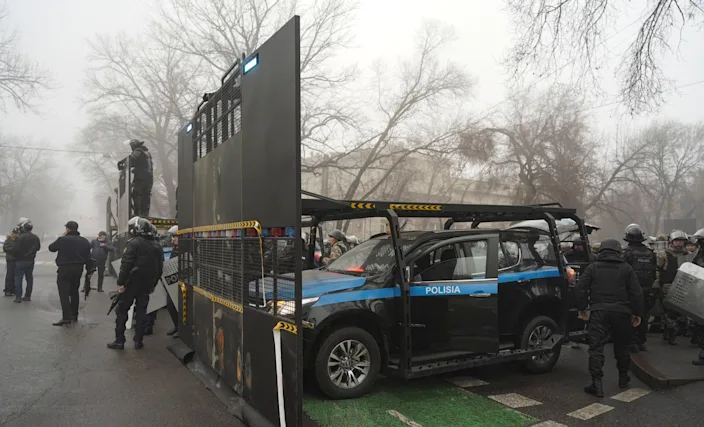 Riot police officers prepare for violent skirmishes (EPA)