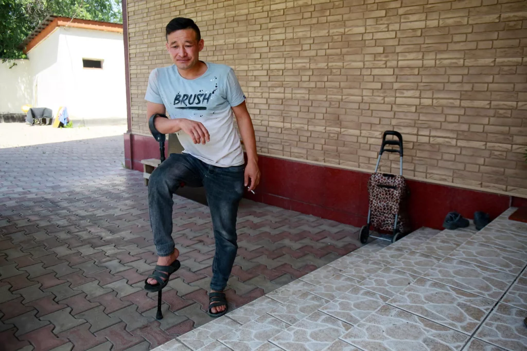 Metal worker Akylzhan Kiysimbayev -- who was wounded during the events in January -- was still on crutches when AFP spoke to him Ruslan PRYANIKOV AFP